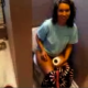 A low-quality video of a girl sitting on the toilet taking a shit - filmed by some guy.